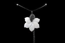 Load image into Gallery viewer, Mother Of Pearl Magnolia Flower Pendant With Tiny Gray Crystals On One Petal With Oxide Gunmetal Chain
